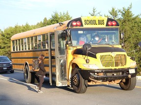 A school bus stops for a student to board during the first day of school in Greater Sudbury on Tuesday.