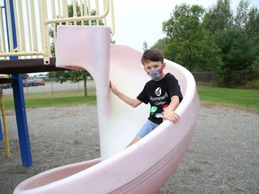 Grade 3 student Kaiden Hulme, of Ecole St-Augustin in Garson, goes for a slide on Tuesday. John Lappa/Sudbury Star