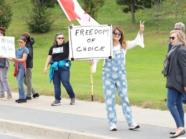 Protesters take part in a rally against vaccine passports and vaccine mandates in workplaces during a rally on Paris Street near Health Sciences North in Sudbury, Ont. on Monday September 13, 2021. Close to 50 people participated in the event. John Lappa/Sudbury Star/Postmedia Network