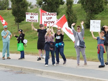 Protesters take part in a rally against vaccine passports and vaccine mandates in workplaces during a rally on Paris Street near Health Sciences North in Sudbury, Ont. on Monday September 13, 2021. Close to 50 people participated in the event. John Lappa/Sudbury Star/Postmedia Network