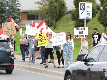 Protesters take part in a rally against vaccine passports and vaccine mandates in workplaces during a rally on Paris Street near Health Sciences North in Sudbury, Ont. on Monday September 13, 2021. Close to 50 people participated in the event. John Lappa/Sudbury Star/Postmedia Network