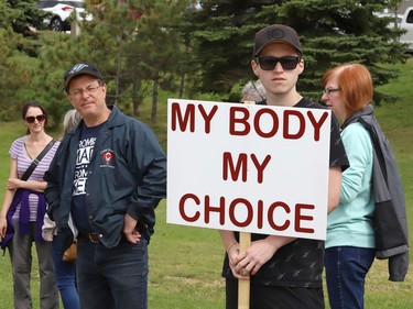 Protesters take part in a rally against vaccine passports and vaccine mandates in workplaces during a rally on Paris Street near Health Sciences North in Sudbury, Ont. on Monday September 13, 2021. Close to 50 people participated in the event. John Lappa/Sudbury Star/Postmedia Network