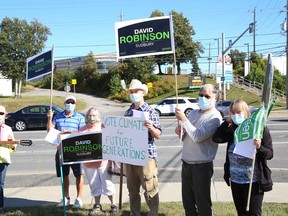 Sudbury Green Party candidate David Robinson, second right, and supporters take part in a pop-up rally in Sudbury, Ont. on Wednesday September 15, 2021. John Lappa/Sudbury Star/Postmedia Network