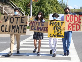 Climate activists Arjun Shukla, left, Sophia Mathur, Narayan Shukla and Ahmed Mohamed, of Fridays For Future Greater Sudbury, take part in a rally in Sudbury, Ont. on Friday September 17, 2021. John Lappa/Sudbury Star/Postmedia Network