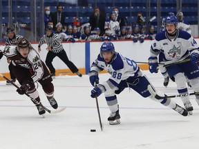 David Goyette, middle, of the Sudbury Wolves, breaks to the net as Artem Guryev, of the Peterborough Petes, gives chase during OHL exhibition action at the Sudbury Community Arena in Sudbury, Ont. on Friday September 17, 2021. John Lappa/Sudbury Star/Postmedia Network
