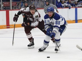 David Goyette, right, of the Sudbury Wolves, breaks to the net as Artem Guryev, of the Peterborough Petes, gives chase during OHL exhibition action at the Sudbury Community Arena in Sudbury, Ont. on Friday September 17, 2021. John Lappa/Sudbury Star/Postmedia Network