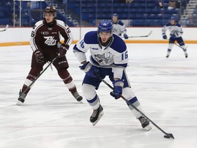 Nick Degrazia, right, of the Sudbury Wolves, skates past Jax Dubois, of the Peterborough Petes, during OHL exhibition action at the Sudbury Community Arena in Sudbury, Ont. on Friday September 17, 2021. John Lappa/Sudbury Star/Postmedia Network