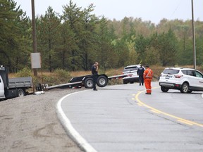 Greater Sudbury Police were in the area of Longyear Drive in Falconbridge, Ont. on Tuesday September 21, 2021 after reports of a hit and run where the driver of one of the involved vehicles fled on foot into a wooded area. He also allegedly stole a Canada Post vehicle. John Lappa/Sudbury Star/Postmedia Network