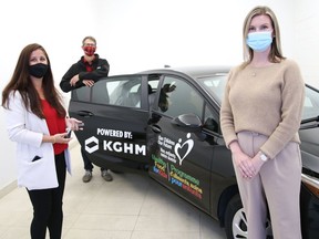 Lynne Ethier, left, of Our Children Our Future, Steven Gregory, of KGHM International, and Kristen Pollesel, of Crosstown Chevrolet Buick GMC, take part in a car presentation in Sudbury, Ont. on Thursday September 23, 2021. KGHM has stepped up and paid for a two-year lease on a vehicle for Our Children Our Future. John Lappa/Sudbury Star/Postmedia Network