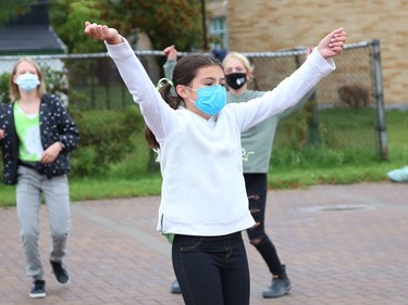 Allison Ouimet, of Ecole Ste-Marie, takes part in a celebration with classmates by dancing and singing to music at a celebration for Franco-Ontarian Day in Azilda, Ont. on Friday September 24, 2021. All schools in OntarioÕs 12 French-language school boards participated in a 90-minute virtual celebration on Friday. Students from Conseil scolaire catholique Nouvelon schools participated in the mega celebration by watching a live broadcast at mondrapeaufranco.ca. The broadcast can be viewed until October 1. John Lappa/Sudbury Star/Postmedia Network