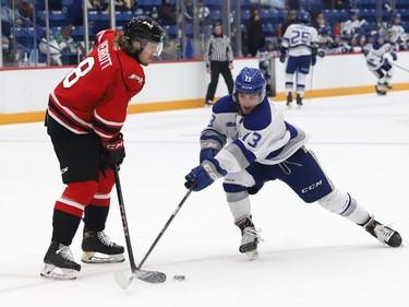 Kocha Delic, right, of the Sudbury Wolves, steals the puck from Andrew Perrott, of the Owen Sound Attack, during OHL exhibition action at the Sudbury Community Arena in Sudbury, Ont. on Friday September 24, 2021. John Lappa/Sudbury Star/Postmedia Network