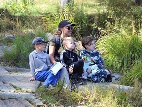 Amy-Lee Campbell and her boys, Thor, 7, left, King, 5, and Dash, 8, take in the scenery at Lake Laurentian in Sudbury, Ont. on Monday September 27, 2021. John Lappa/Sudbury Star/Postmedia Network