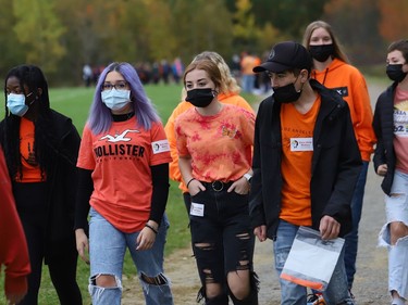 Students participate in a walk in honour of the life of Chanie Wenjack at St. Benedict Catholic Secondary School in Sudbury, Ont. as part of National Day for Truth and Reconciliation and Orange Shirt Day on Thursday September 30, 2021. Chanie ran away from his residential school near Kenora at age 12 in 1966, and died from hunger and exposure. The educational walk also raised awareness of the true history of residential schools. John Lappa/Sudbury Star/Postmedia Network
