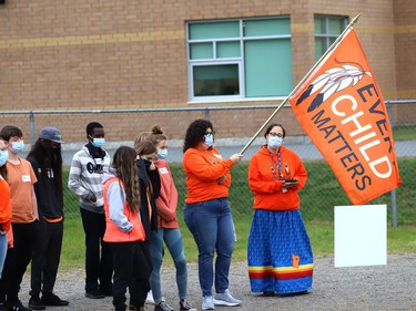 Teacher Loretta Cuda and Indigenous support worker Shannon Agowissa lead a walk in honour of the life of Chanie Wenjack at St. Benedict Catholic Secondary School in Sudbury, Ont. as part of National Day for Truth and Reconciliation and Orange Shirt Day on Thursday September 30, 2021. Chanie ran away from his residential school near Kenora at age 12 in 1966, and died from hunger and exposure. The educational walk also raised awareness of the true history of residential schools. John Lappa/Sudbury Star/Postmedia Network