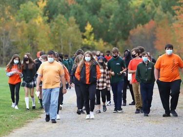 Students participate in a walk in honour of the life of Chanie Wenjack at St. Benedict Catholic Secondary School in Sudbury, Ont. as part of National Day for Truth and Reconciliation and Orange Shirt Day on Thursday September 30, 2021. Chanie ran away from his residential school near Kenora at age 12 in 1966, and died from hunger and exposure. The educational walk also raised awareness of the true history of residential schools. John Lappa/Sudbury Star/Postmedia Network