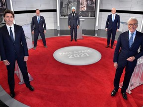 Canadian Prime Minister and leader of the Liberal Party Justin Trudeau (left), Bloc Quebecois leader Yves-Francois Blanchet, NDP leader Jagmeet Singh, Conservative leader Erin O'Toole and Canadian journalist Pierre Bruneau pose for the official photo at the TVA studios (Canadian French-language terrestrial television network) ahead of the Face-a-Face 2021 debate in Montreal, Quebec on September 2, 2021. MARTIN CHEVALIER/POOL/AFP via Getty Image