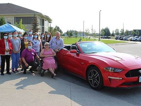 From the left are the administration and support staff of St. Gabriel's Villa, resident Joan Watier and son Tim Kuntz. Joan Watier was the 2021 Make a Wish Winner at St. Gabriel's Villa. She received four nominations from members of her care team. On Aug. 26, her wish became a reality. Joan's bucket list included going for a ride in a convertible and her care staff wanted to see her spoiled for the day including lunch and time spent with good friends and family. Perhaps what made this wish the most memorable was the opportunity for Joan to spend time with her son Tim, who flew in from British Columbia. Mother and son had the opportunity to spend three days cruising around town, top down, catching up on the past year and a half. Supplied