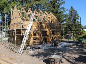 A new log cabin is under construction near the entrance to the Children's Animal Farm in Sarnia's Canatara Park. Paul Morden/Postmedia Network