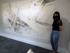 Sarnia artist Laura Kreviazuk stands beside one of her works of art, part of an exhibition with fellow local artist Laura Manzano Arias entitled Adjacent Views being shown at Gallery in the Grove. Carl Hnatyshyn/Sarnia This Week