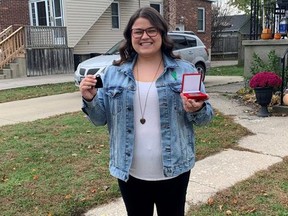 Lindsay Kirkland of Sarnia holds her 2020 YMCA Peace Medal she received from the YMCA of Southwestern Ontario in this file photo. The YMCA is looking for nominees for its annual Peace Medal. File photo/Postmedia Network