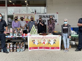 Members of the Timmins Fire Department, North Eastern Ontario Family and Children's Services and the Foster Families Association Ontario North-East teamed up for the third-annual Fill The Fire Truck food drive last week.

Supplied