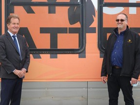 Timmins Mayor George Pirie and transit maintenance supervisor Marcel Côté are seen here standing in front one of the orange city buses late last summer.

Dariya Baiguzhiyeva/Local Journalism Initiative