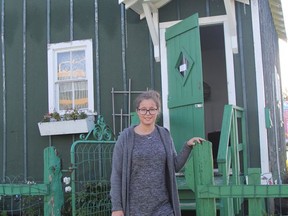 Ryleigh Belec, a museum attendant, stands outside the Hollinger House at the Timmins Museum, which was opened for tours this past weekend as part of a launch of the Digital Doors Open Ontario initiative. For more information about local sites that are participating in the online tours, visit www.doorsopenontario.on.ca and click on timmins-porcupine.

RON GRECH/The Daily Press