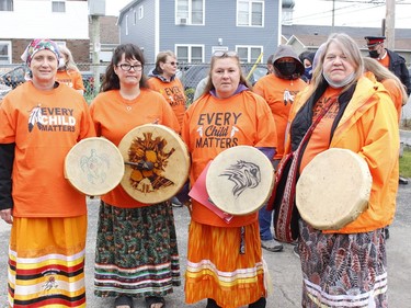 Tina Prevost, from left, Ginette Rozon, Samantha St. Pierre and Donna Palermo sang and performed on their hand drums during the Orange Shirt Day walk in Timmins Thursday.

RICHA BHOSALE/The Daily Press
