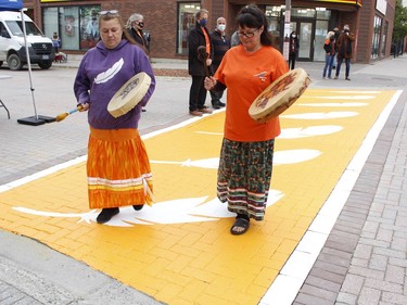 Prior to the Orange Shirt Day walk, Samantha St Pierre, on left with Ginette Rozon, helped to unveil a newly painted crosswalk designed in Downtown Timmins to commemorate National Day for Truth and Reconciliation. The unveiling was also attended by the members of Downtown Timmins Business Improvement Association, Timmins Chamber of Commerce and Mayor George Pirie. 

RICHA BHOSALE/The Daily Press