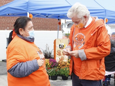 Timmins-James Bay MP Charlie Angus chats with one of the participants prior to the start of the Orange Shirt Day walk in Timmins Thursday.

RICHA BHOSALE/The Daily Press