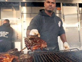 'Shimmy' from Ribs Royale Barbecue was on the grill Friday night at the seventh annual Tillsonburg Ribfest. (Chris Abbott/Norfolk and Tillsonburg News)