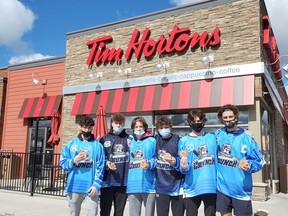 Players for the Cochrane Crunch team split up and spend parts of three days at Tim Hortons taking donations during the Smile Cookie Campaign in one of their community projects. Money raised during the annual week will be used by the Cochrane Lions Club to help local citizens and organizations.