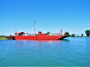 Cable ferry to St. Anne Island. Photo taken Aug. 15, 2021, looking north, up the south leg of the Snye. In the photo, the ferry is moored to the St Anne Island shore of the Snye. John Martinello photo