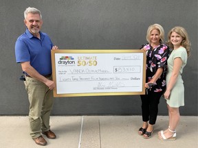 Drayton Entertainment artistic director Alex Mustakas, left, with August Ultimate 50-50 winner Vanda OstojicMiddel, St. Thomas, and her daughter Katie.Drayton Entertainment