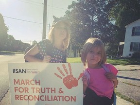 Fae and Rune Marshal, the two daughers of organizer Patricia Marshal, help get ready for Thursday's march on the National Day of Truth and Reconcilation.
SUBMITTED PHOTO