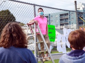 Keewatin resident Dawn Mitchell addresses a small crowd at Central Park on Wednesday, Sept. 15. The group gathered to protest the city's decision to re-zone the western half of the park for the development of housing. The zoning amendment is currently in front of Ontario's planning tribunal.