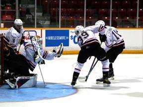 Mack Guzda grabs the puck out of the air with his trapper as the Owen Sound Attack host the Barrie Colts inside the Harry Lumley Bayshore Community Centre Saturday night, the first Attack home game since March 11, 2020. Greg Cowan/The Sun Times