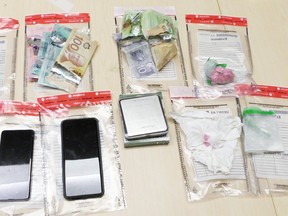 Cocaine, fentanyl, $320 cash and other equipment used for drug trafficking were seized by Kingston Police on Sept. 23, 2021, in Kingston. Supplied Photo
