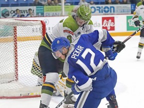 Matej Pekar, front, of the Sudbury Wolves and Avery Winslow of the North Bay Battalion battle for the puck during OHL action at the Sudbury Community Arena in Sudbury, Friday, Jan. 24, 2020. John Lappa/Sudbury Star/Postmedia Network