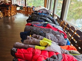 Piles of donations cover the tables at the Mattawa River Resort and Cardinal Restaurant, Friday. The owner helped launch a winter clothing drive for those in need in Mattawa and throughout the area. The clothing drive kicks off, Saturday, at 10 a.m. at the Mattawa River Resort. Submitted Photo