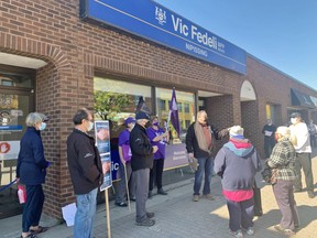 Henri Giroux, a member of the North Bay Health Coalition, speaks to media and supporters during a small rally, Monday, outside Nipissing MPP Vic Fedeli's office. Jennifer Hamilton-McCharles/The Nugget
