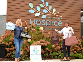 Event chair Heather Bryan and Rotary Hospice Stratford Perth events and communications coordinator Michelle Field show off some of the handbags donated by local businesses that are available for bid through Thursday's Handbags for Hospice fundraiser. Galen Simmons/The Beacon Herald/Postmedia Network