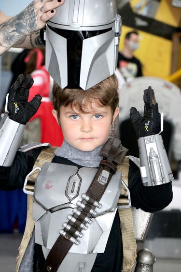 Tate Spurr, 5, gets help with his helmet for his Mandalorian character at Steel City NerdCon at Canadian Bushplane Heritage Centre on Saturday, Oct. 2, 2021 in Sault Ste. Marie, Ont. (BRIAN KELLY/THE SAULT STAR/POSTMEDIA NETWORK)