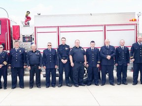 Left to right: Harry Frykas (retired Captain), Brian Wilson, Chief Kerry Cleave, Lieutenant Rosaire Goudreau, John Hammerschidt, Senior firefighter Joe Kramer, Jaron Brauer, Deputy Chief, Matt Clarke, Captain Terry Whelan, Senior firefighter Randy Perkins, Scott Perkins, Captain Chris Crane, Captain Ken Coghill. Absent from the photo is retired Lieutenant, Lionel Marier, who took the photo.