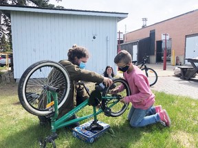 Jeremy McCracken showed young folks how to keep up with maintenance of their bikes in May and June.