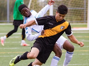 Nathaniel Hartley, foreground, competes for the Cambrian Golden Shield in exhibition soccer action.