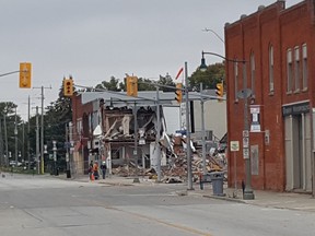 Workers are shown in downtown Wheatley on Tuesday at the site of the Aug. 26 explosion. A geophysical survey is now underway in the area. (Trevor Terfloth/The Daily News)