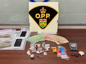 Three people are facing a variety of charges after police searched a Simcoe property on Monday, Oct. 4.