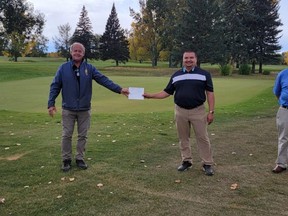 Rotary Club of High River president John Andresen accepts a cheque for $766.30 from Director of Golf Operations Dan Warwaruk of the Highwood Golf Course for the Spitzee golf Thursdays they ran on Sept. 6. Rotarians Alison Laycraft and Rob Whitefield were also in attendance.