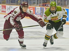 Josh Kavanagh of the Peterborough Petes contends with Liam Arnsby of the North Bay Battalion in Ontario Hockey League action. Arnsby is one of five Battalion players named as Players to Watch. Sean Ryan Photo